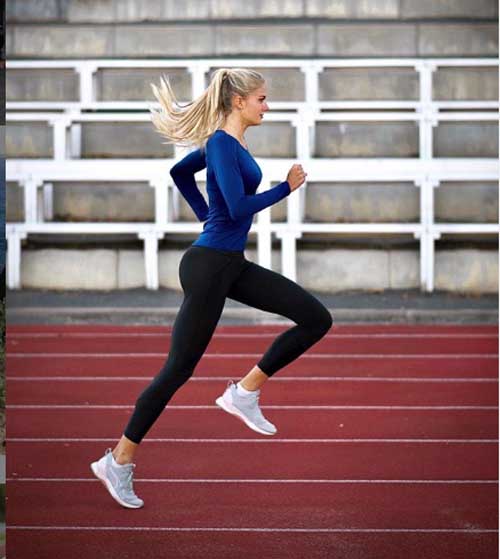 A picture of Alica Schmidt running in a track.